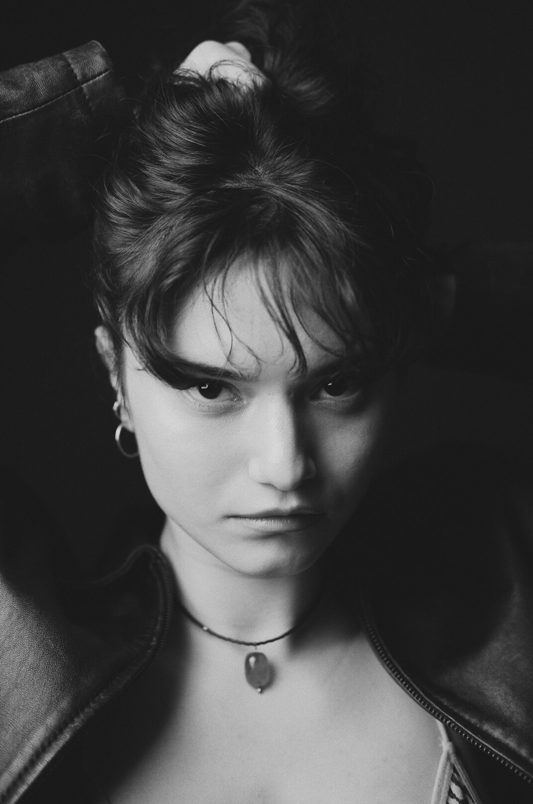 Studio portrait of a woman with short brown hair