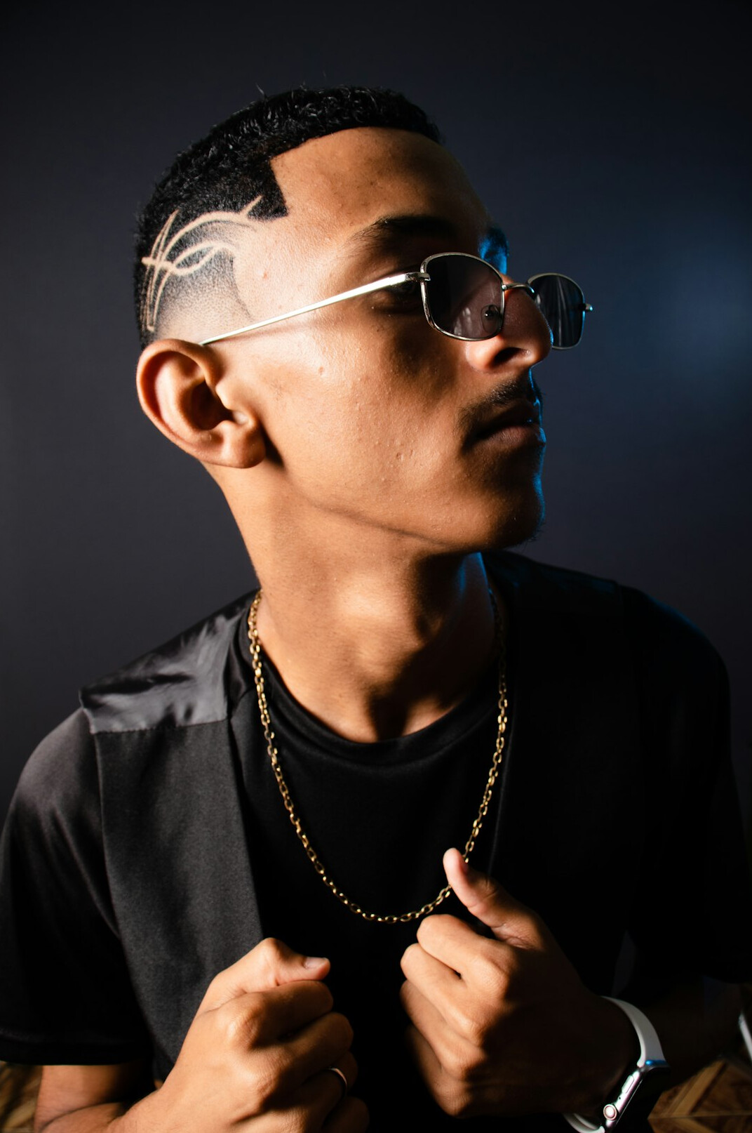 Studio portrait of a man wearing glasses